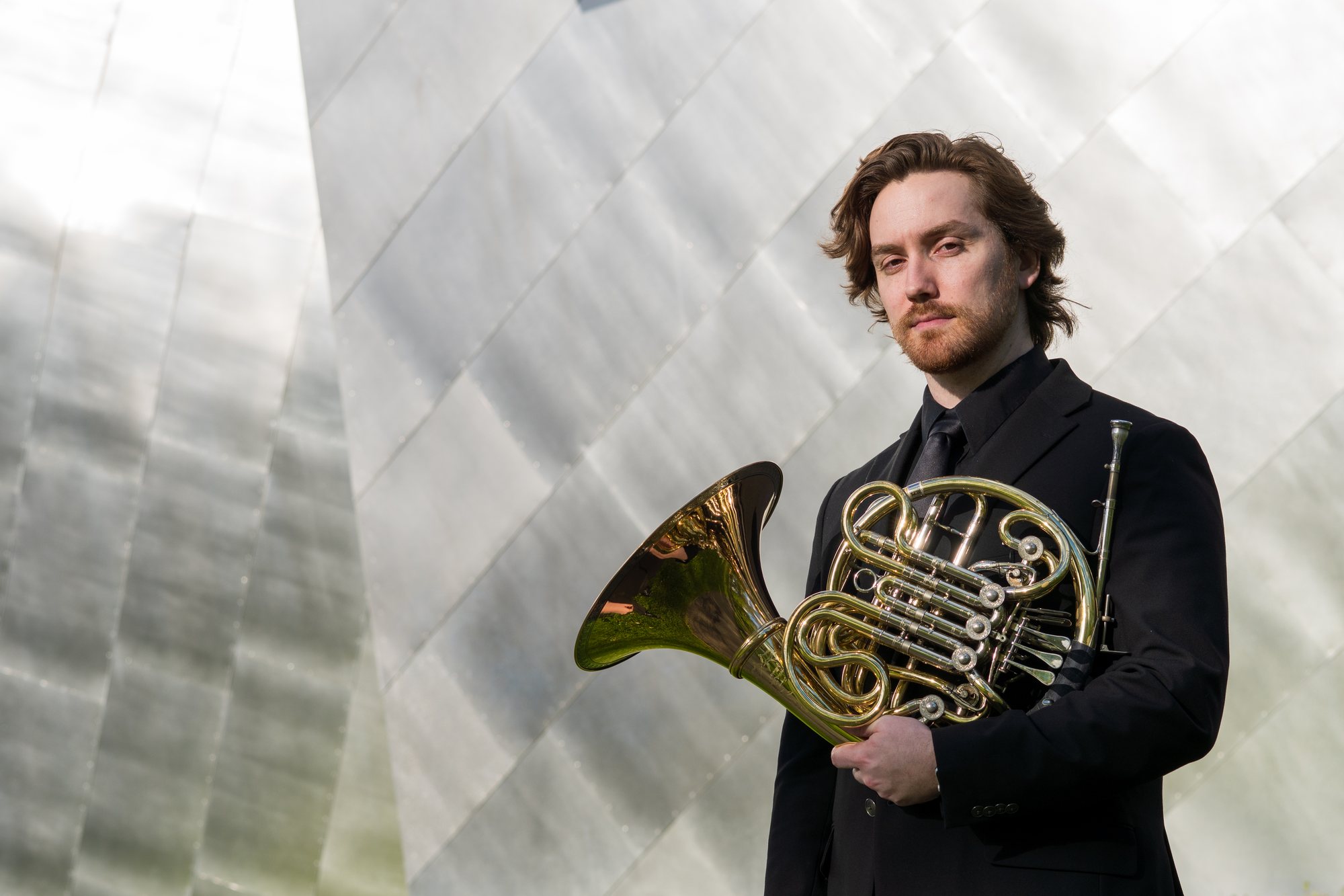 Steven Harmon holding a French horn